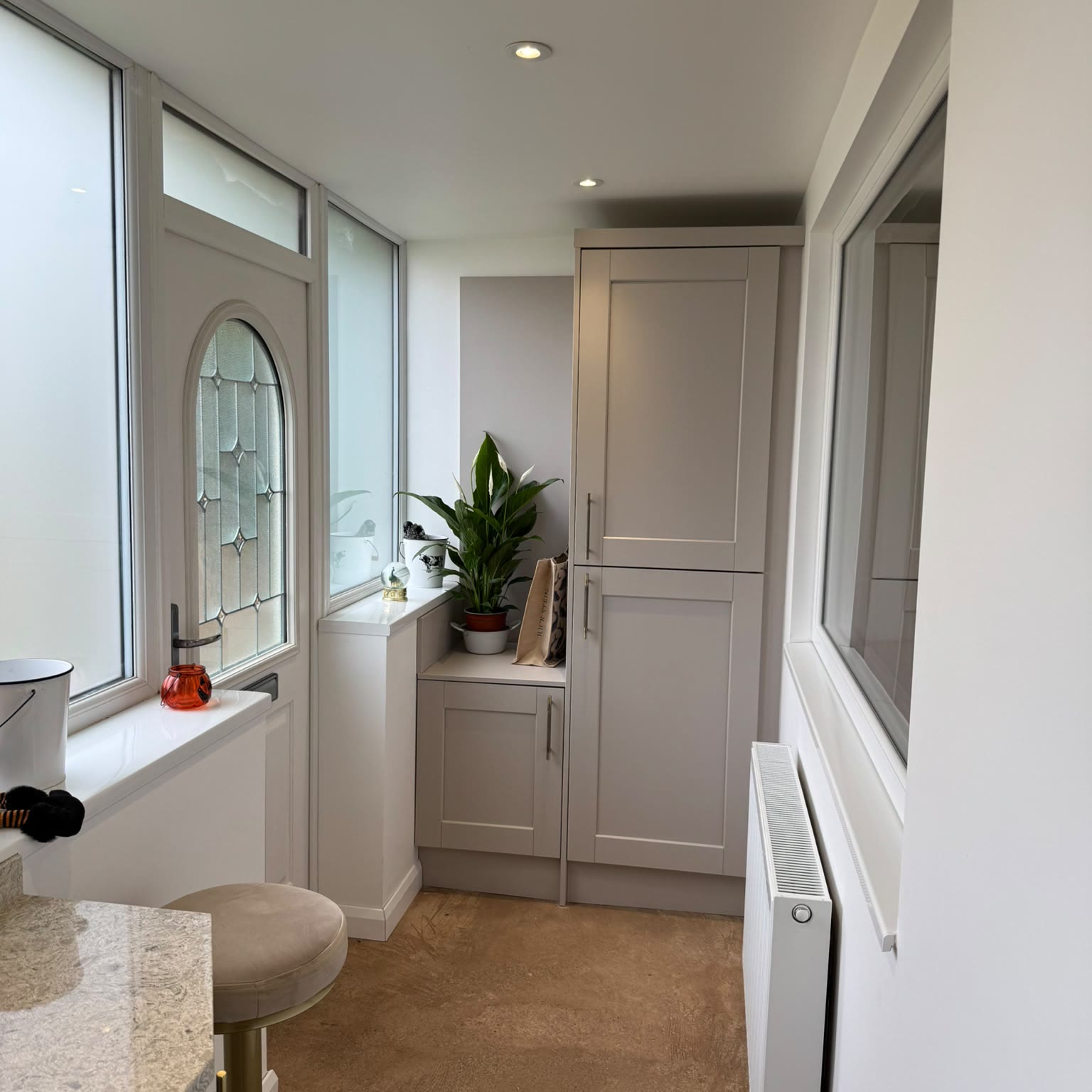 Utility area and rear porch with a downlight over the fitted units